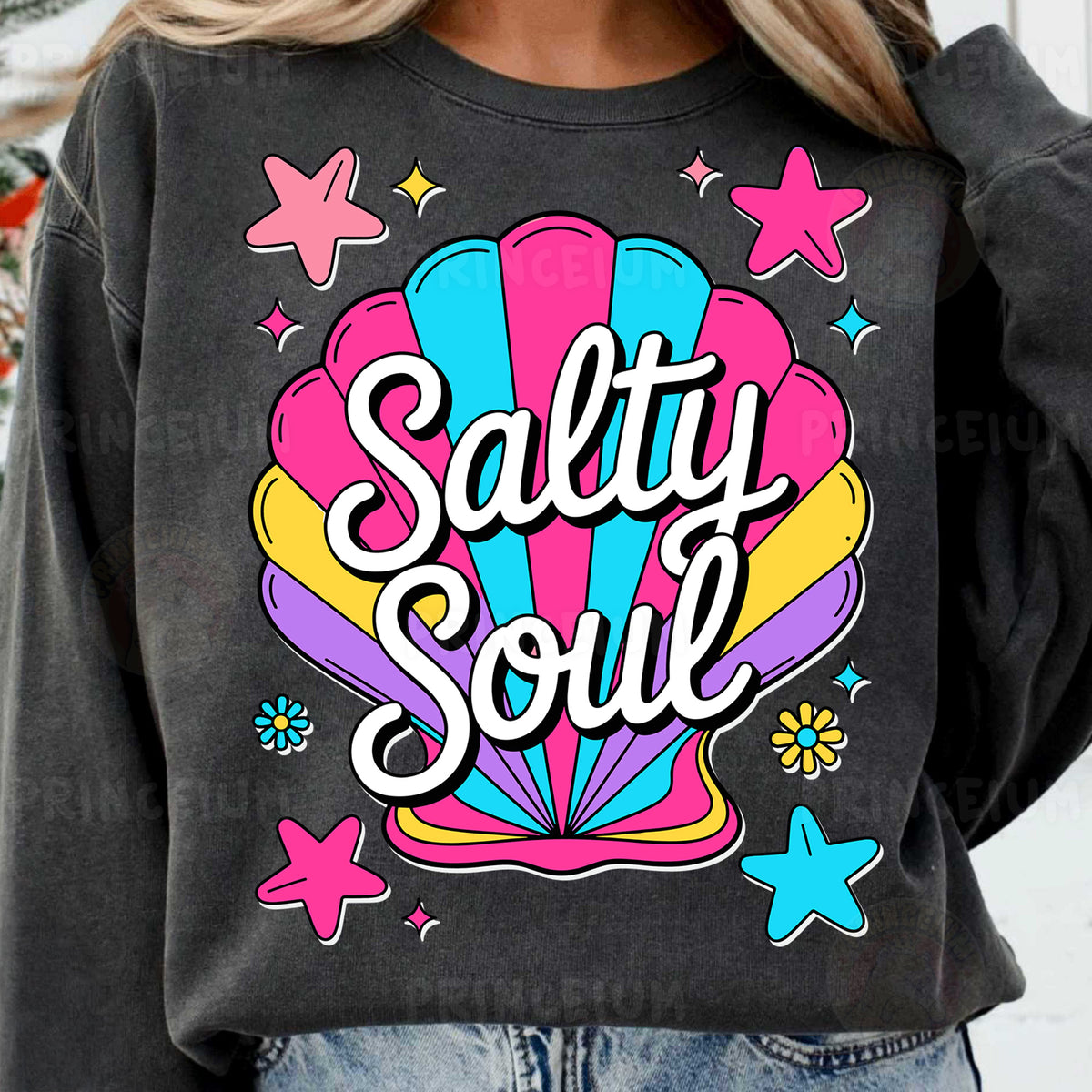 a woman wearing a sweatshirt that says salty soul