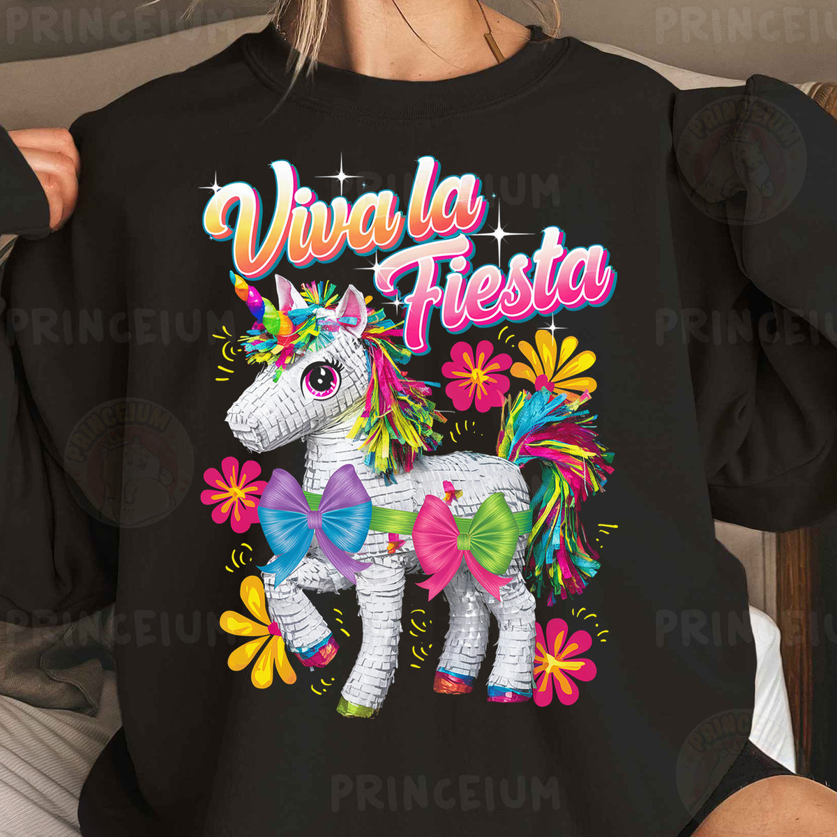 a woman wearing a black shirt with a unicorn on it