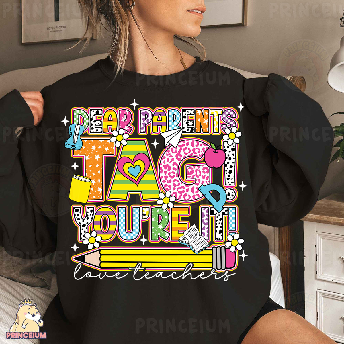 a woman wearing a black shirt that says happy birthday