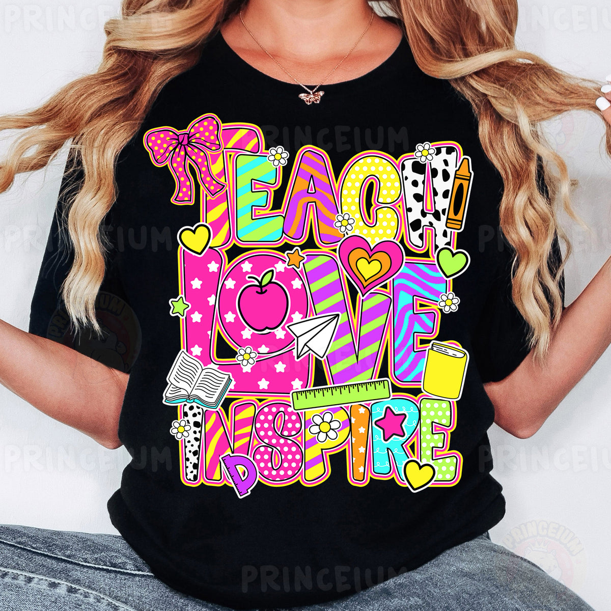 a woman wearing a t - shirt that says teach love inspire