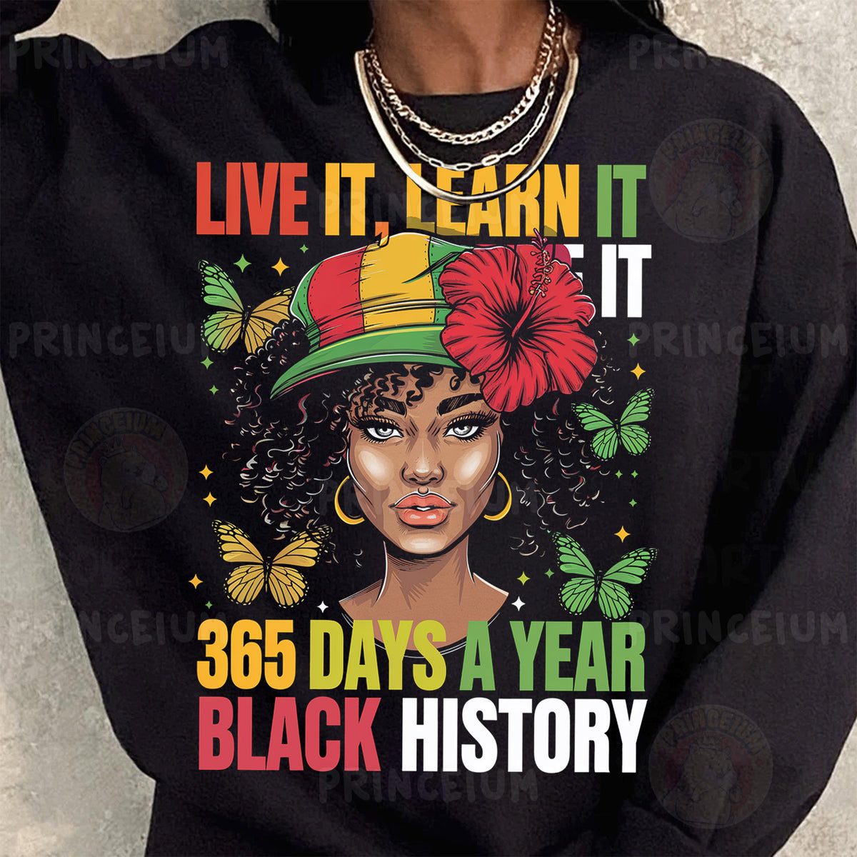 a woman wearing a black shirt with a black history design on it