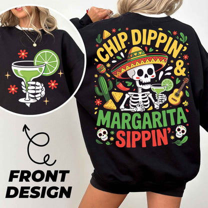 a woman wearing a black sweatshirt with a skeleton wearing a sombrero and a