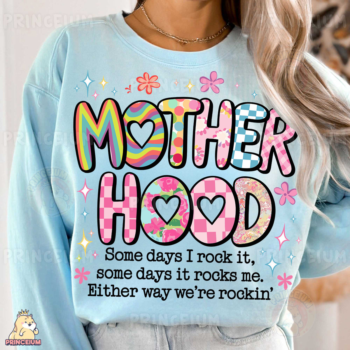 a woman wearing a sweatshirt that says motherhood