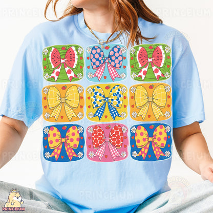 a woman wearing a t - shirt with bows on it