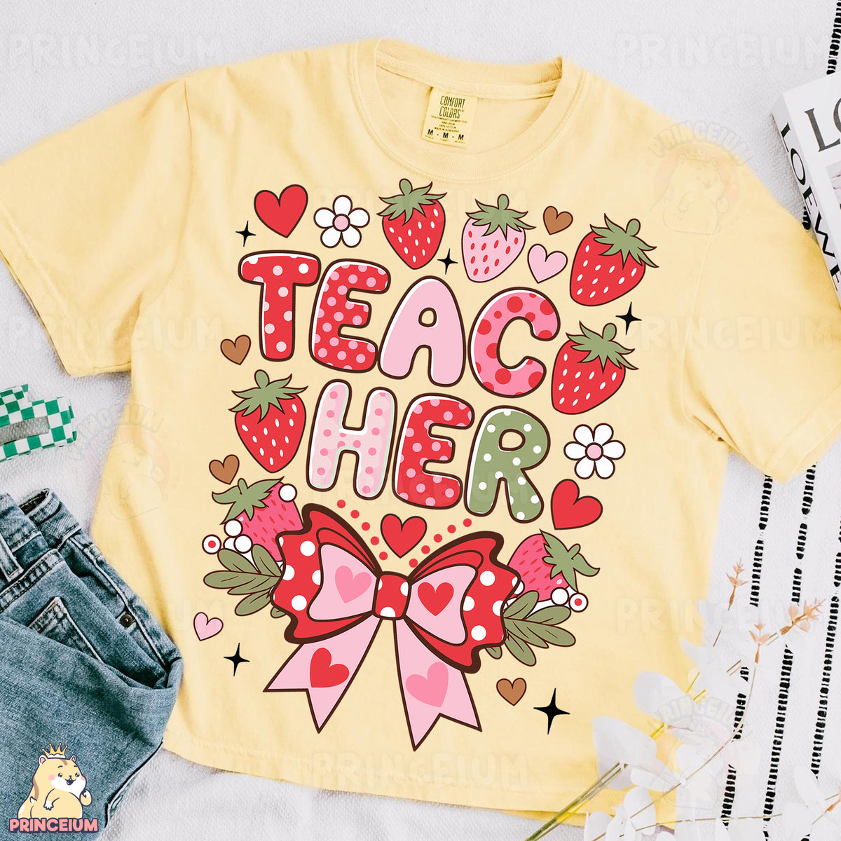 a t - shirt that says teach her with a bow