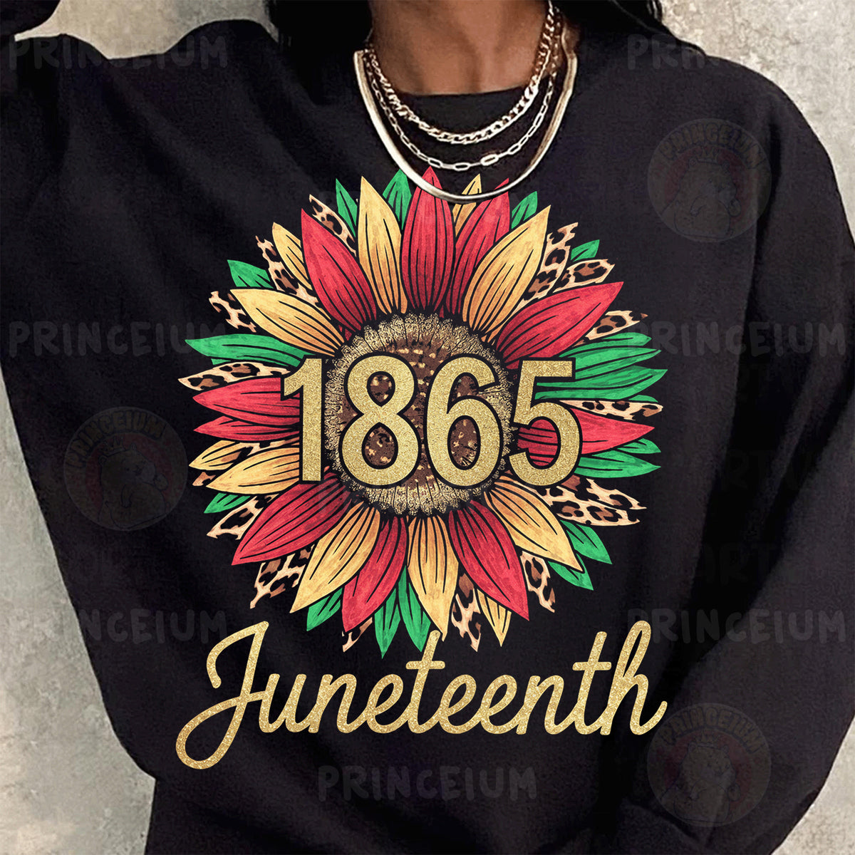 a woman wearing a black sweatshirt with a sunflower on it