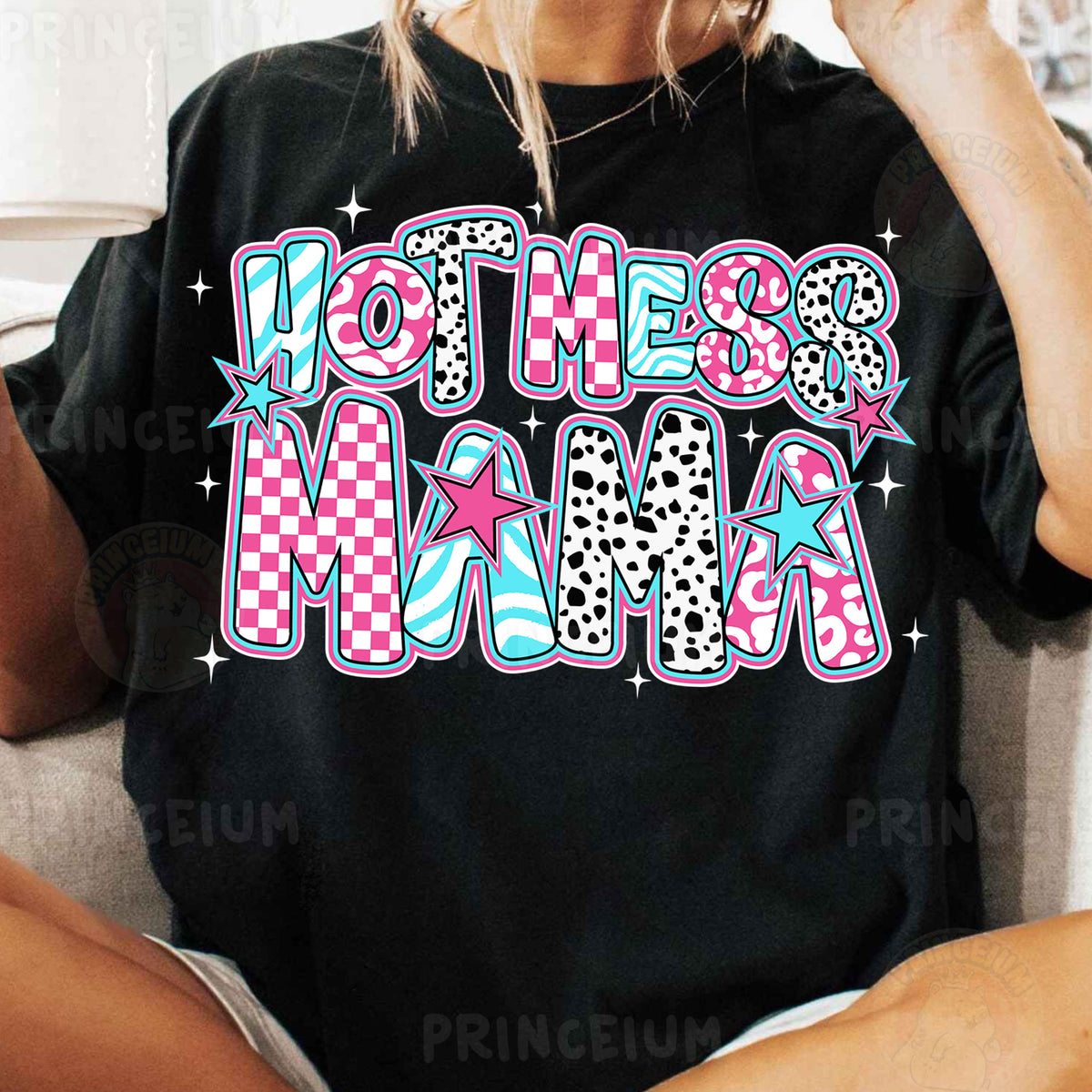 a woman sitting on a couch wearing a black shirt