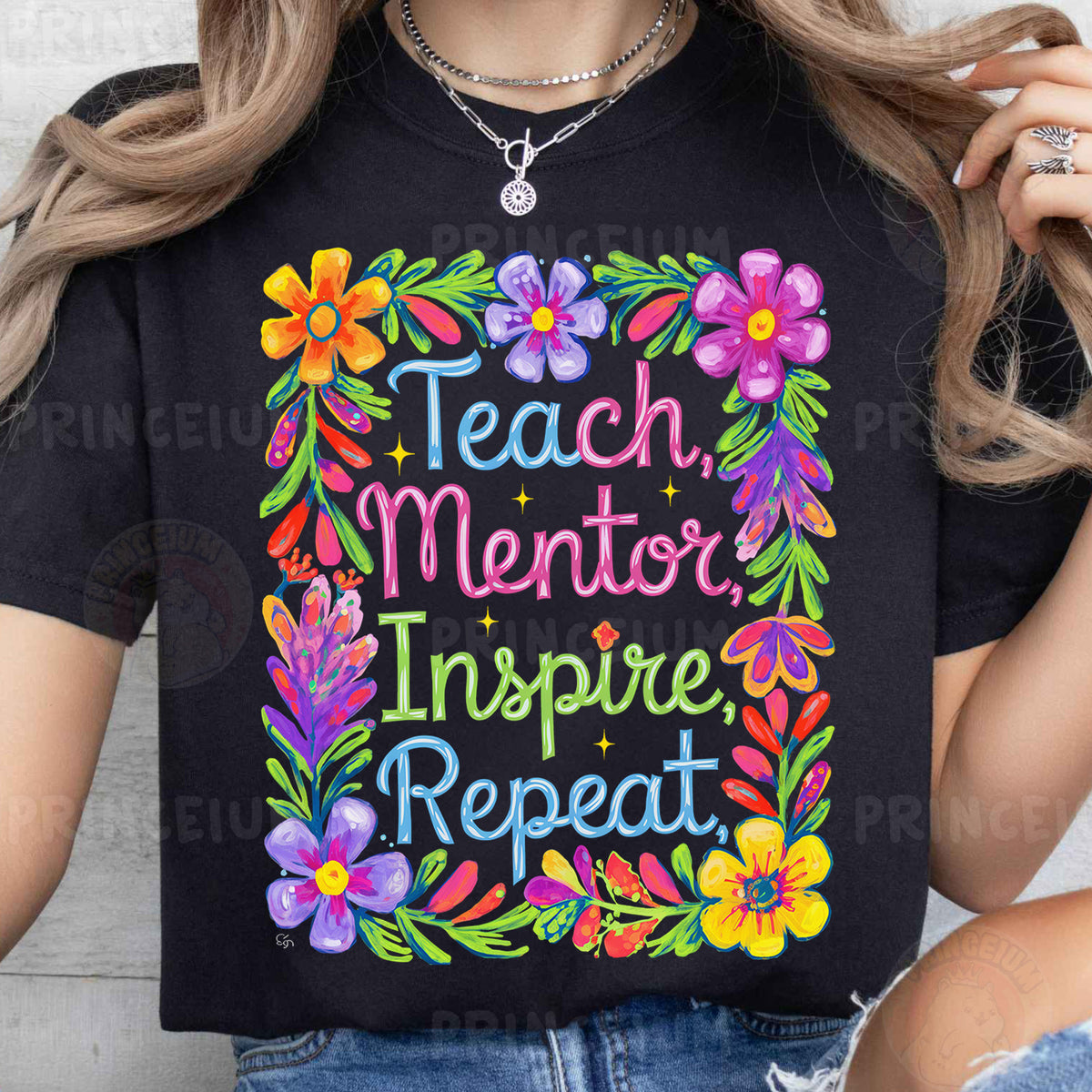 a woman wearing a t - shirt that says teach mentor inspire repeat