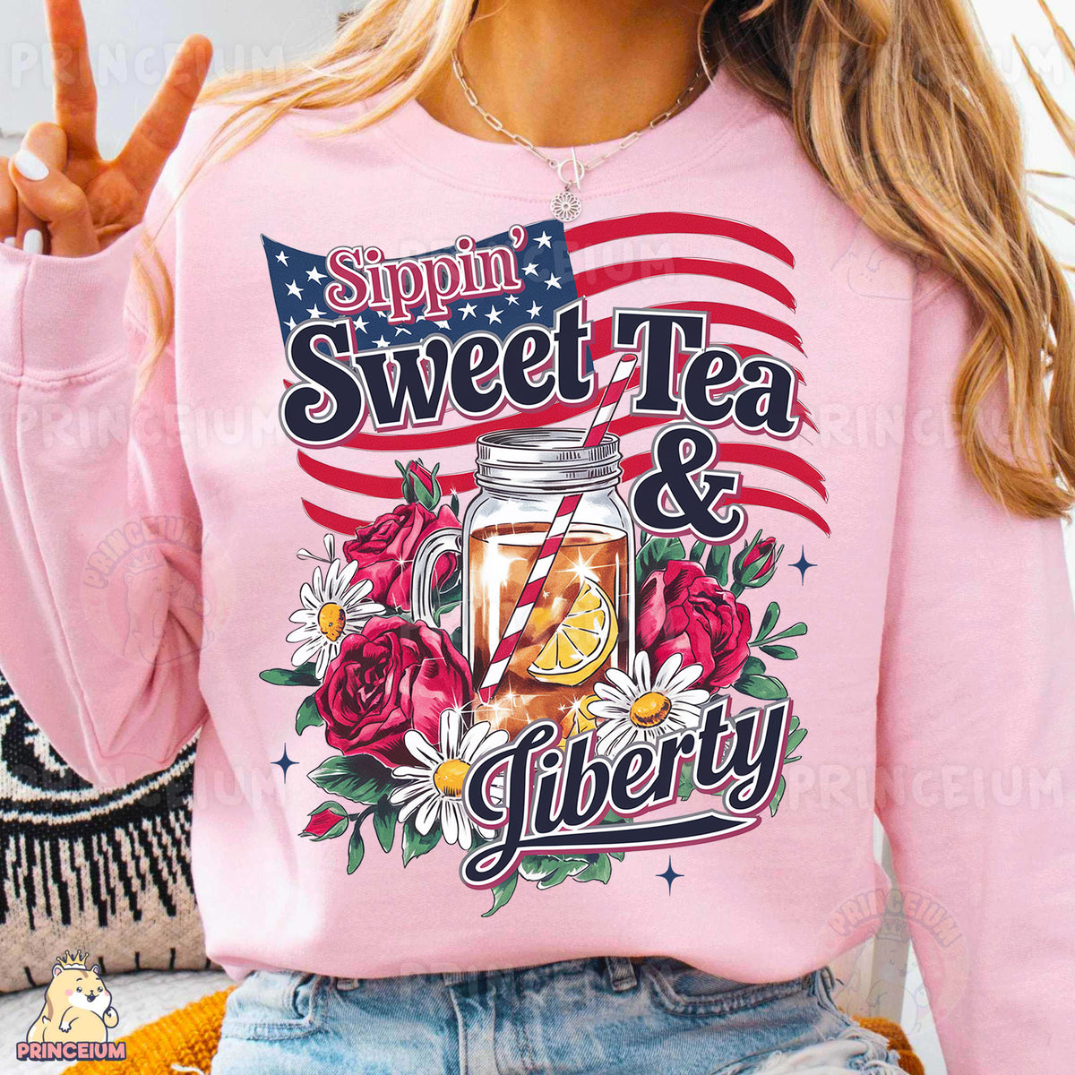 a woman wearing a pink sweatshirt with a jar of tea on it