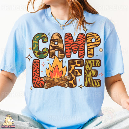 a woman wearing a blue shirt with a camp life design on it