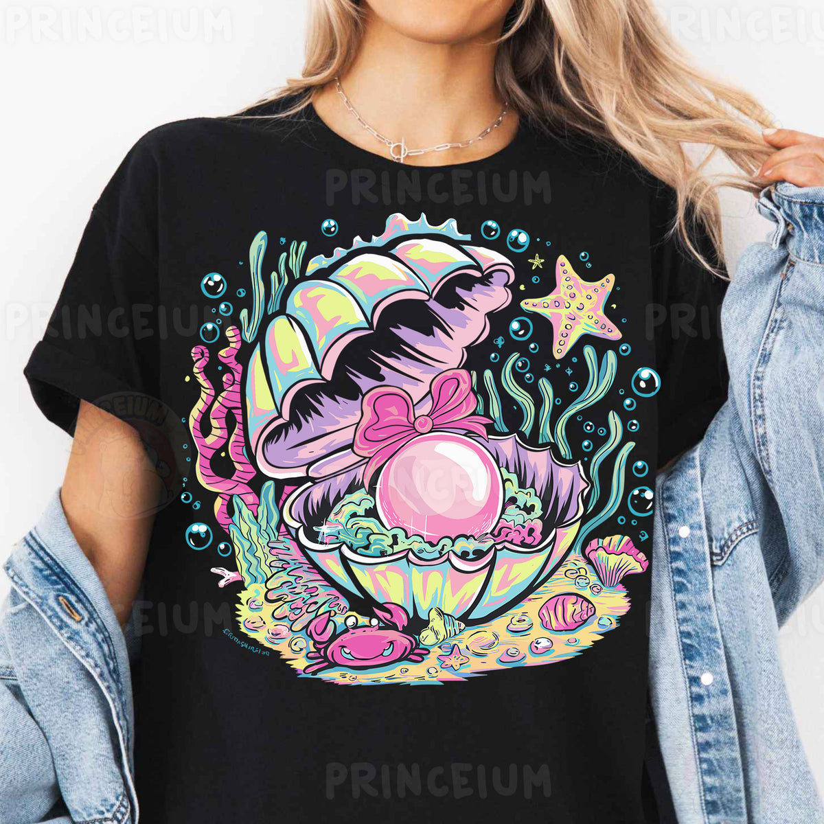 a woman wearing a black shirt with an image of a mermaid on it