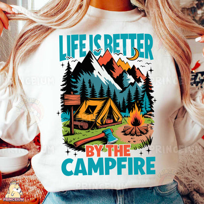 a woman wearing a t - shirt that says life is better by the campfire