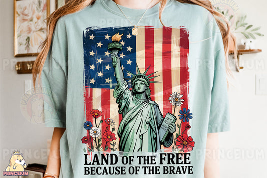 a woman wearing a t - shirt that says land of the free because of the