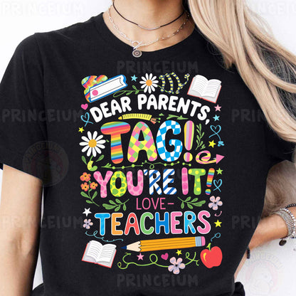 a woman wearing a t - shirt that says dear parents tag you're it