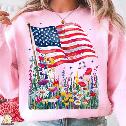 a woman wearing a pink sweatshirt with an american flag on it