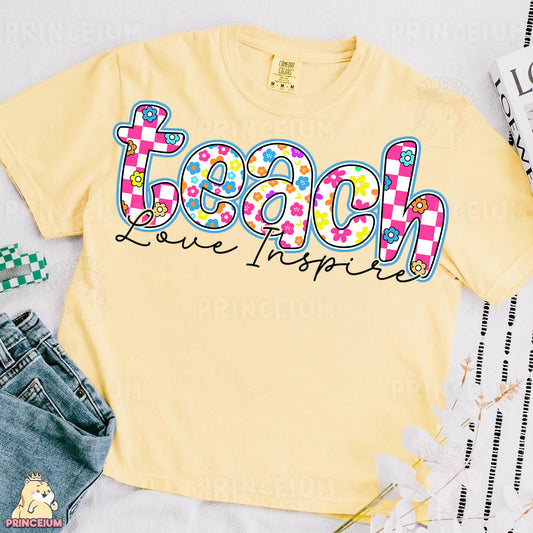 a yellow tee shirt with the word teach on it