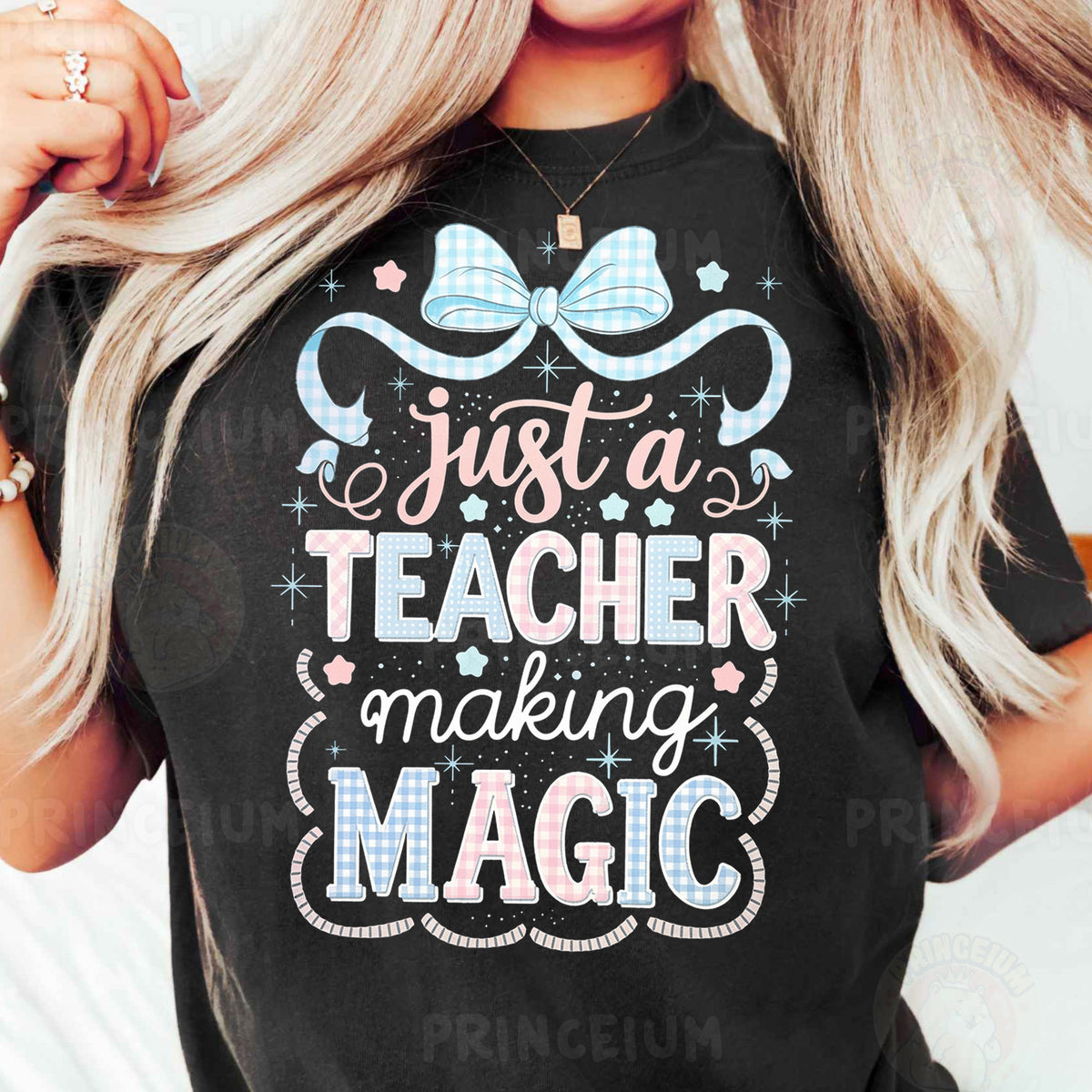a woman wearing a t - shirt that says just a teacher making magic