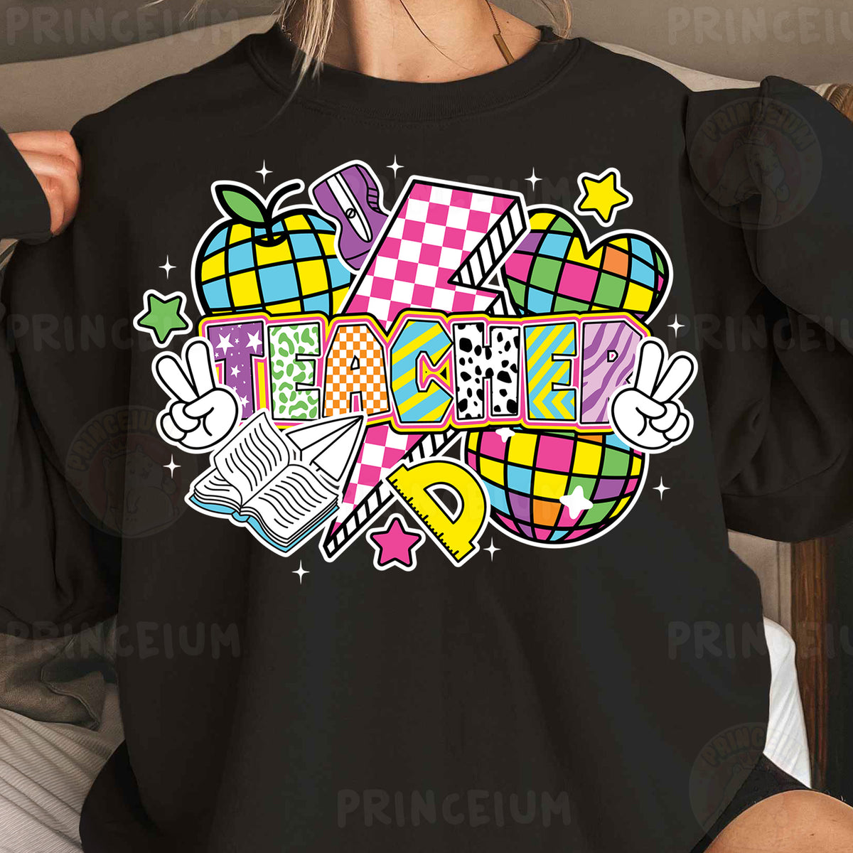 a woman wearing a black shirt with a colorful design on it