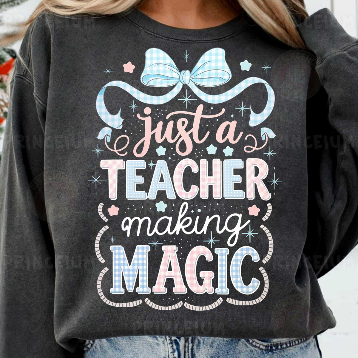a woman wearing a sweatshirt that says just a teacher making magic