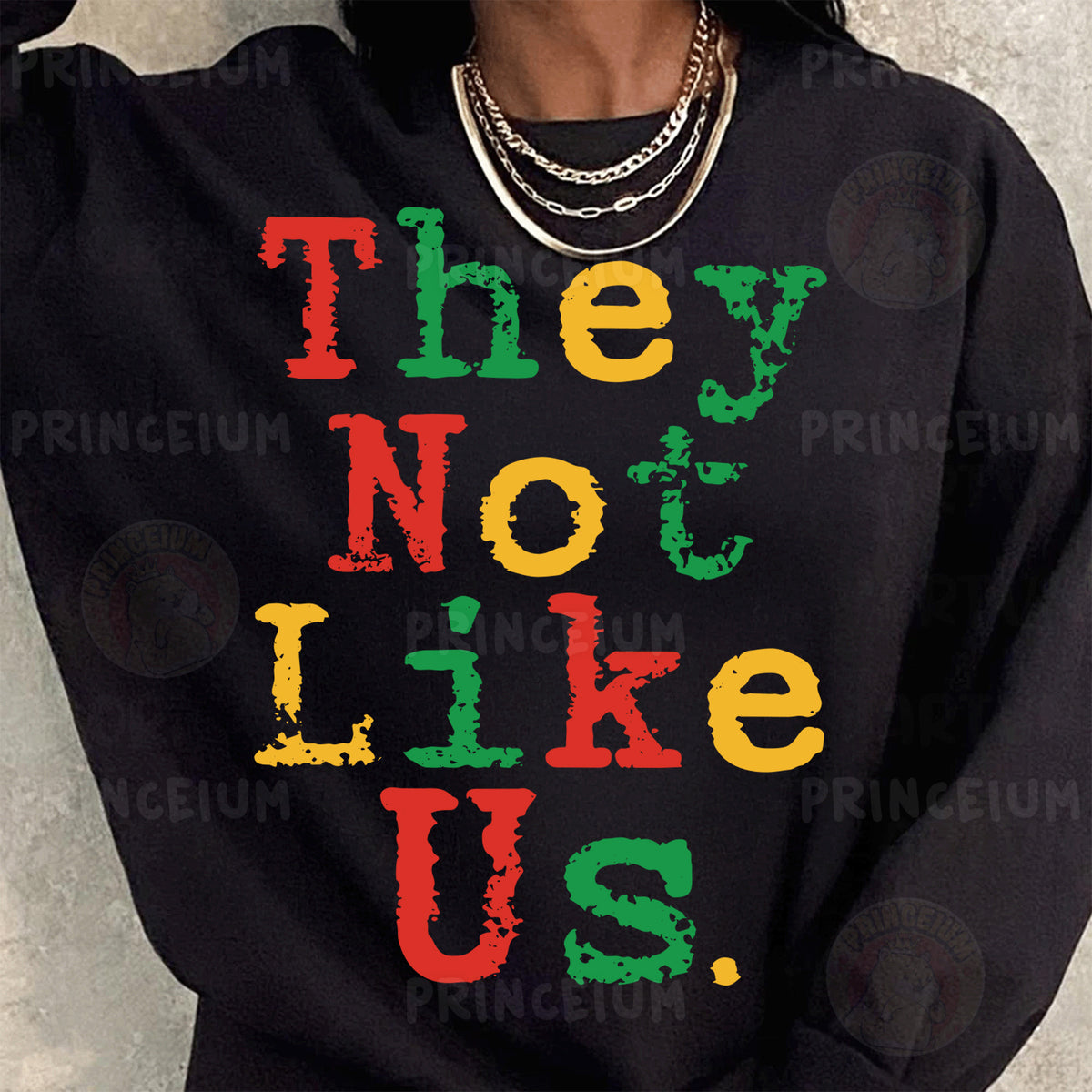 a woman wearing a black sweatshirt that says they not like us