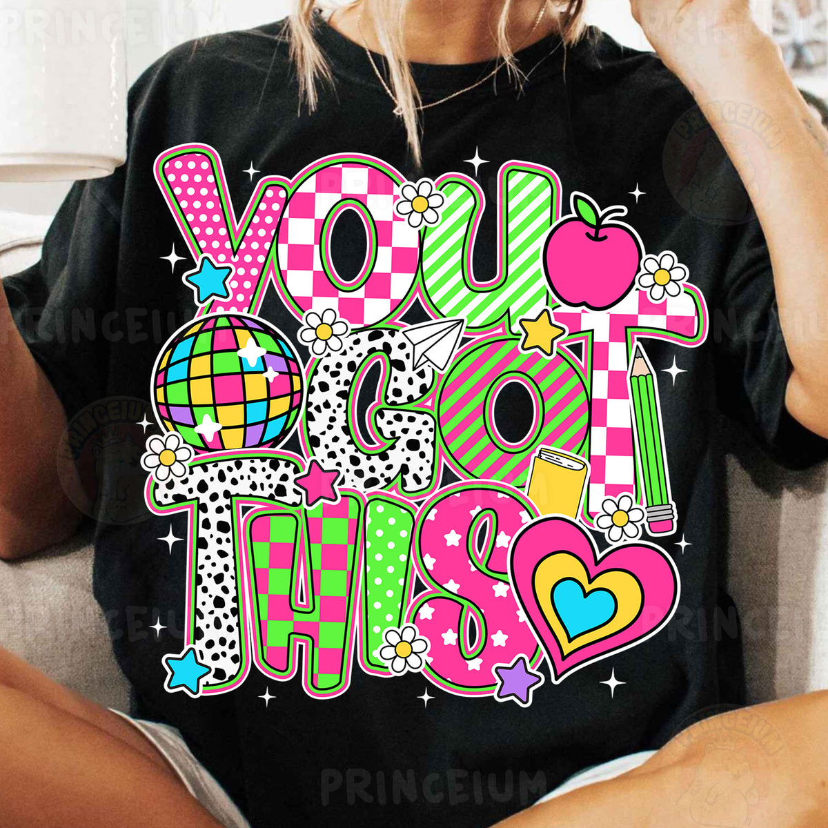 a woman sitting on a couch wearing a t - shirt that says you miss