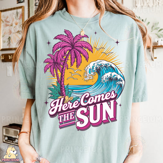 a woman wearing a t - shirt that says here comes the sun