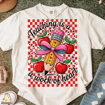 a t - shirt that says teaching is a work of heart