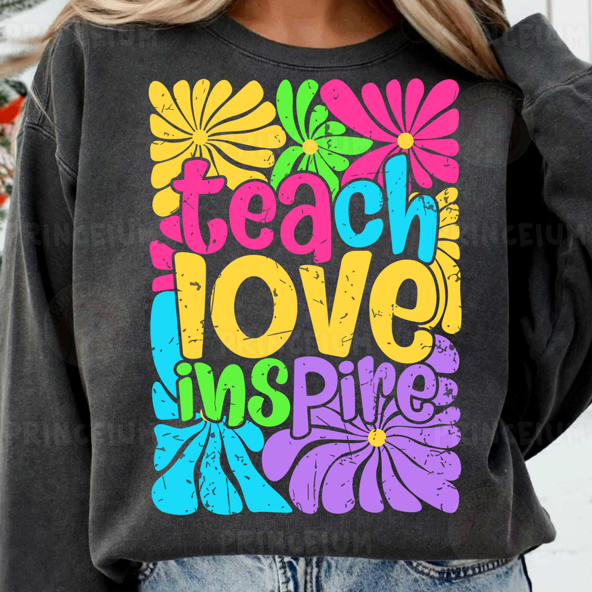 a woman wearing a sweatshirt that says teach love live
