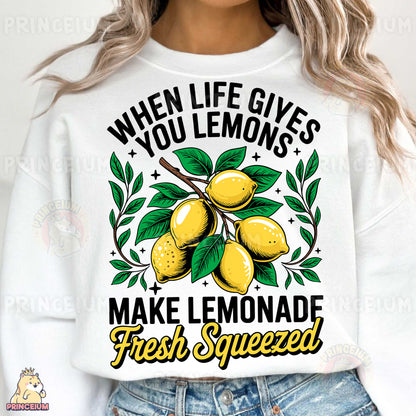 a woman wearing a white sweatshirt that says when life gives you lemons make lemon