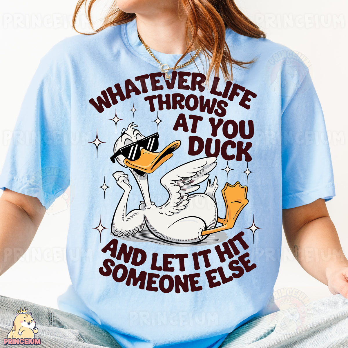a woman wearing a blue shirt with a duck on it