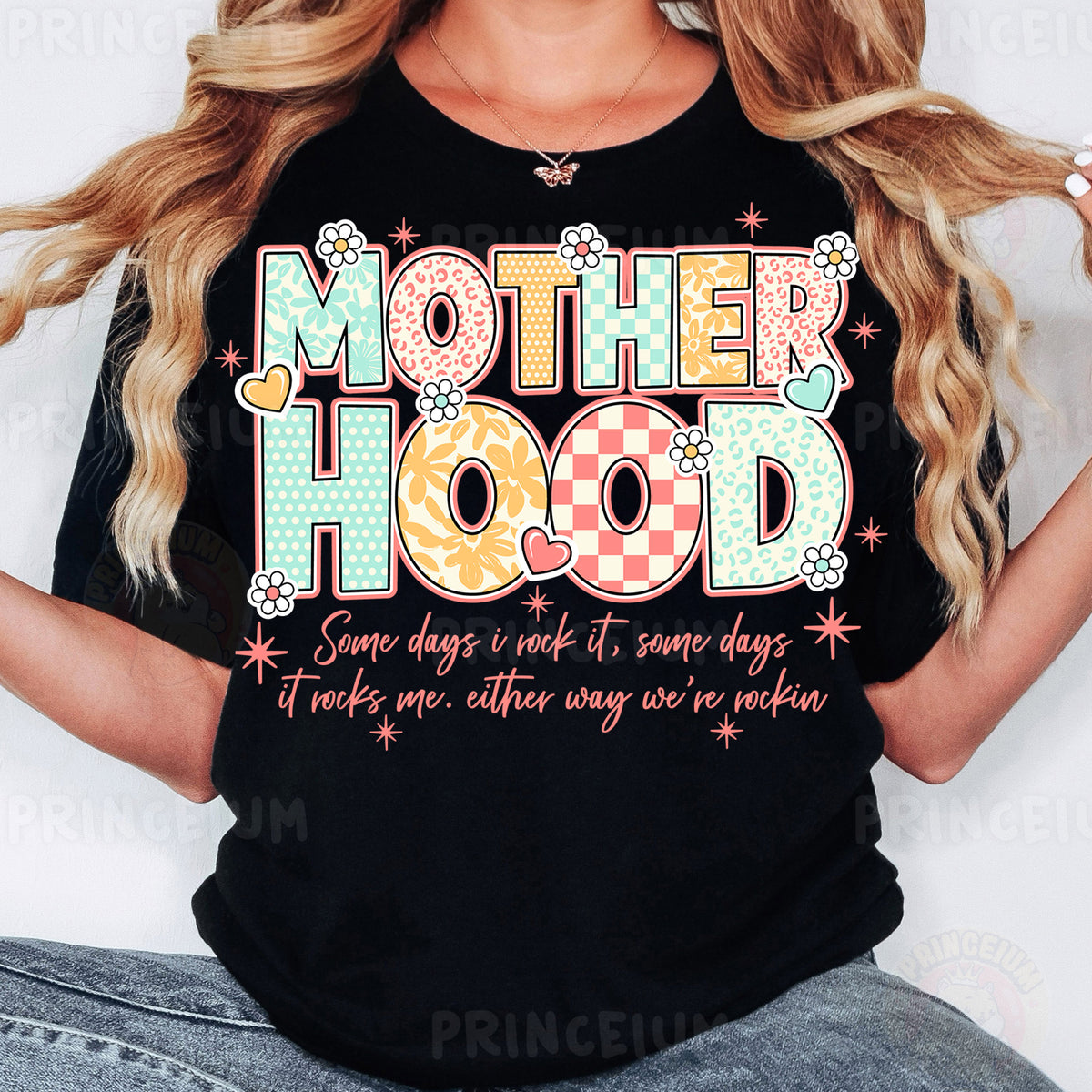 a woman wearing a t - shirt that says motherhood