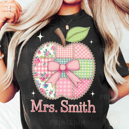 a woman wearing a black tshirt with a pink bow