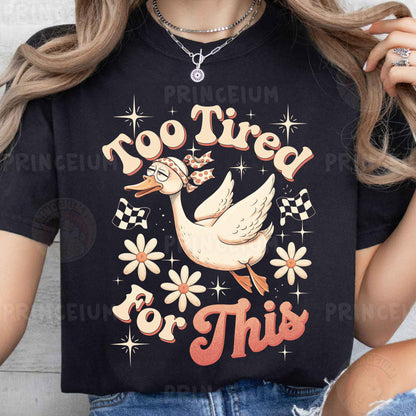 a woman wearing a t - shirt that says too tired for this