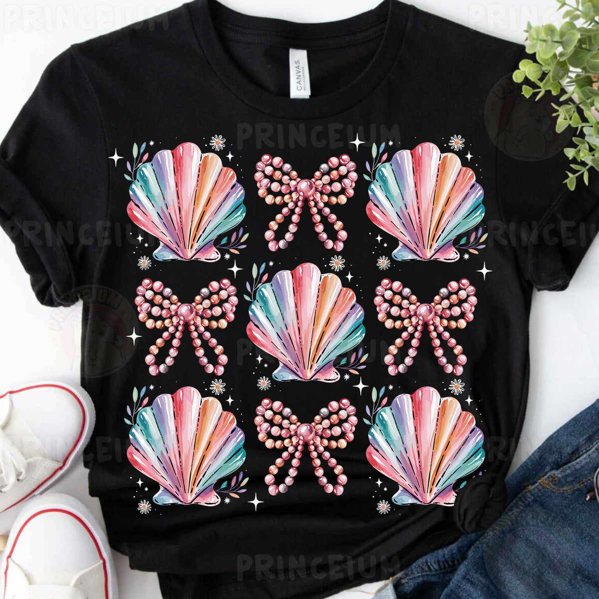 a t - shirt with a bow and pearls on it