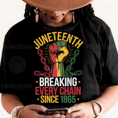 a person wearing a black shirt and a hat holding a cell phone