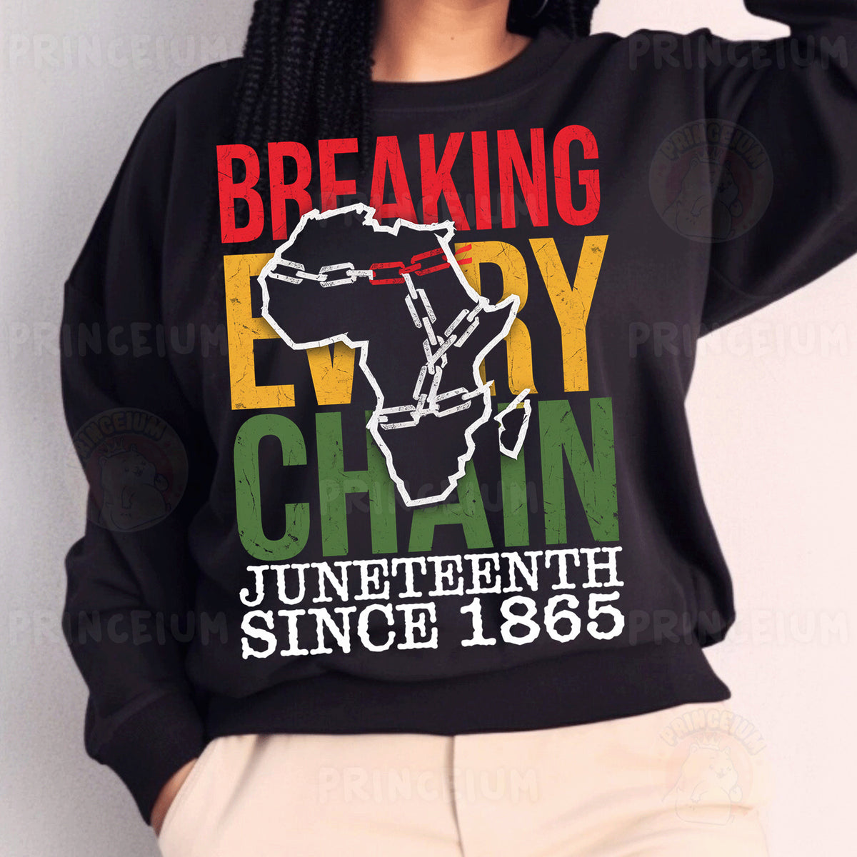 a woman wearing a black sweatshirt with a map of africa on it