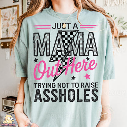 a woman wearing a t - shirt that says just a mama outside trying not to