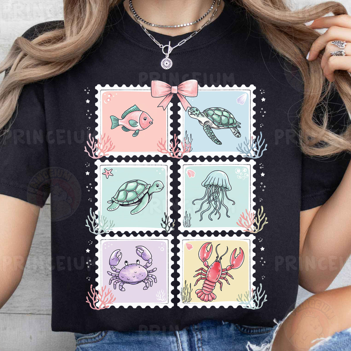 a woman wearing a t - shirt with a picture of sea animals on it