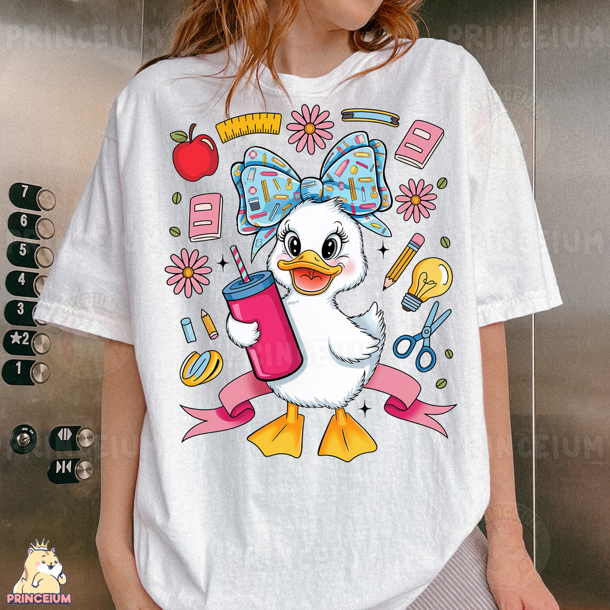 a woman wearing a t - shirt with a picture of a duck holding a drink