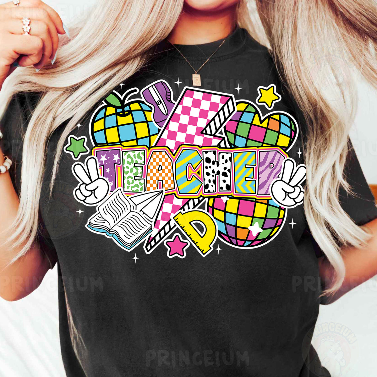 a woman wearing a black t - shirt with colorful designs on it