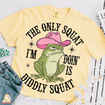 a yellow shirt with a frog wearing a pink cowboy hat