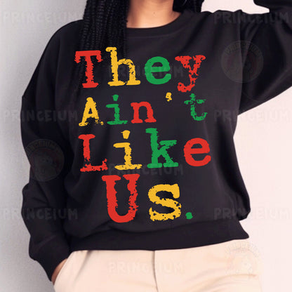 a woman wearing a black sweatshirt with the words they ain't like us on