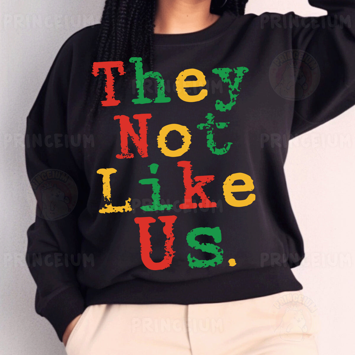 a woman wearing a black sweatshirt that says they not like us