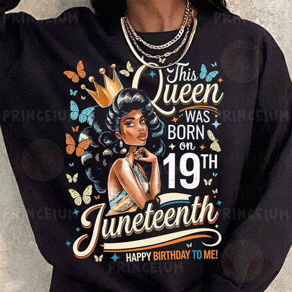 a woman wearing a black sweatshirt with a picture of a woman wearing a tiara