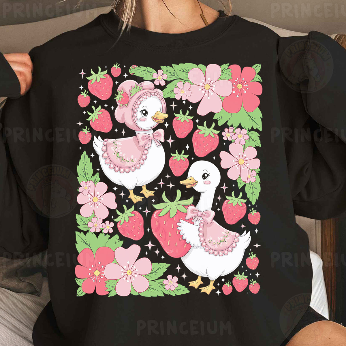 a woman wearing a black shirt with pink flowers and two ducks on it