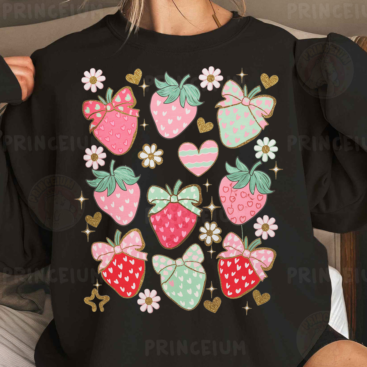 a woman wearing a black shirt with a bunch of strawberries on it
