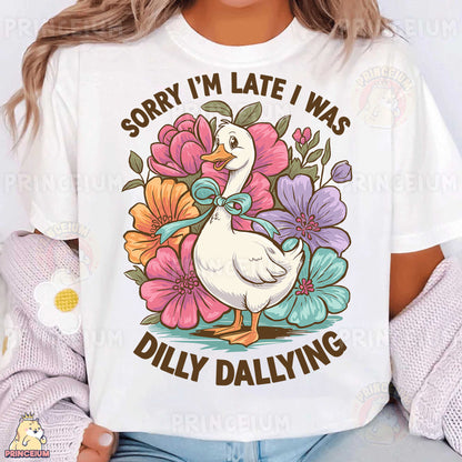 a woman wearing a white t - shirt with a duck and flowers on it