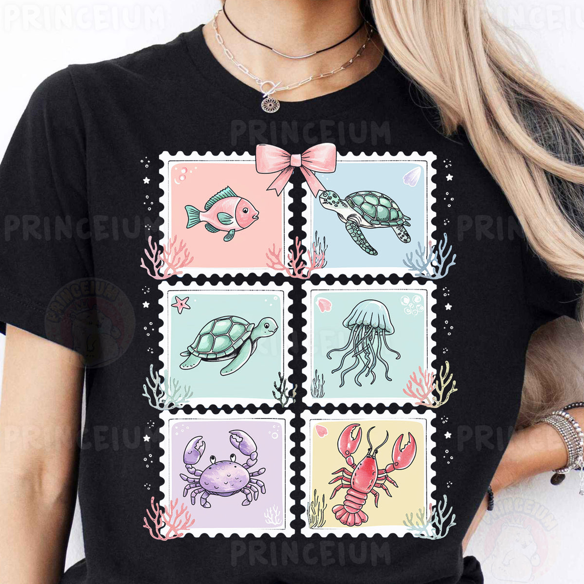 a woman wearing a black t - shirt with sea animals on it
