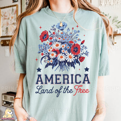 a woman wearing a t - shirt that says america land of the free