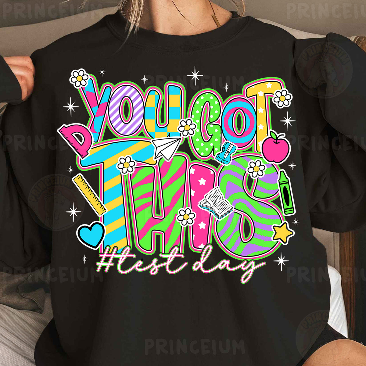 a woman wearing a black shirt that says you got this fiesta